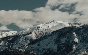 Preview wallpaper mountains, rocks, snow, snowy, peaks, sky