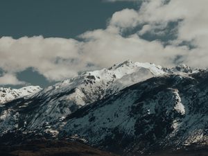 Preview wallpaper mountains, rocks, snow, snowy, peaks, sky