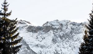 Preview wallpaper mountains, rocks, snow, snowy, spruce, sky