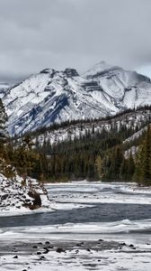 Preview wallpaper mountains, rocks, snow, lake, snowy, trees