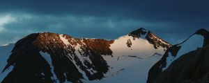 Preview wallpaper mountains, rocks, snow, snowy, sky, stones