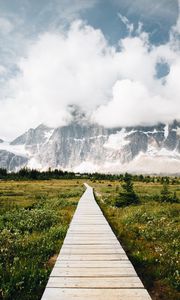 Preview wallpaper mountains, rocks, snowy, path, clouds