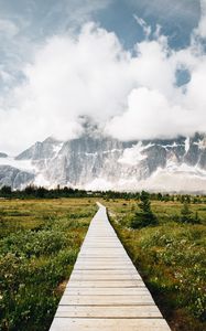 Preview wallpaper mountains, rocks, snowy, path, clouds