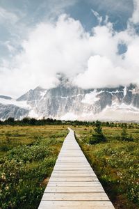 Preview wallpaper mountains, rocks, snowy, path, clouds