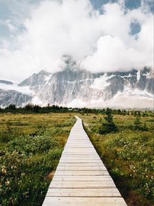 Preview wallpaper mountains, rocks, snowy, path, clouds