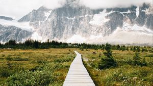 Preview wallpaper mountains, rocks, snowy, path, clouds