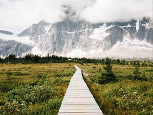 Preview wallpaper mountains, rocks, snowy, path, clouds