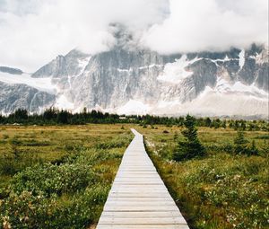 Preview wallpaper mountains, rocks, snowy, path, clouds