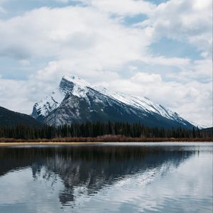 Preview wallpaper mountains, rocks, snowy, trees, reflection