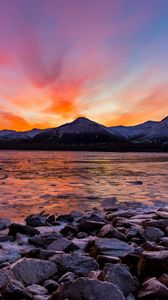 Preview wallpaper mountains, rocks, stones, sunset, sea