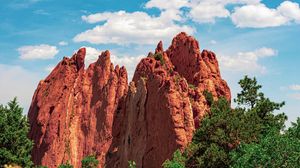 Preview wallpaper mountains, rocks, trees, bushes, clouds, sky
