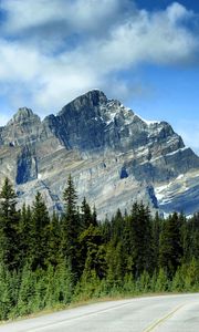 Preview wallpaper mountains, rocks, trees, spruce, sky, road