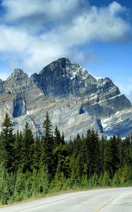 Preview wallpaper mountains, rocks, trees, spruce, sky, road