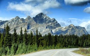 Preview wallpaper mountains, rocks, trees, spruce, sky, road