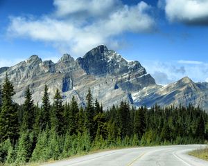 Preview wallpaper mountains, rocks, trees, spruce, sky, road