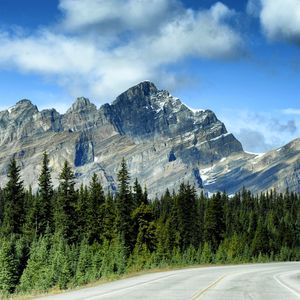 Preview wallpaper mountains, rocks, trees, spruce, sky, road