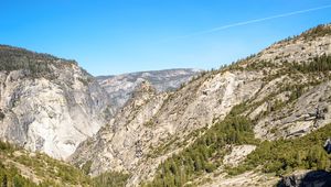 Preview wallpaper mountains, rocks, trees, cliff, river