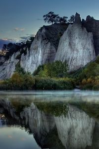 Preview wallpaper mountains, rocks, water smooth surface, evening, silence