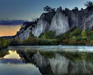 Preview wallpaper mountains, rocks, water smooth surface, evening, silence