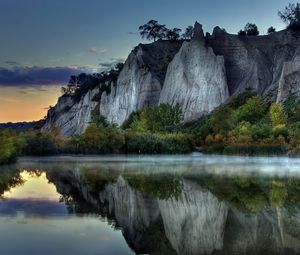 Preview wallpaper mountains, rocks, water smooth surface, evening, silence