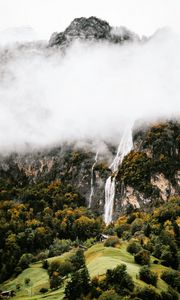 Preview wallpaper mountains, rocks, waterfall, trees, fog, clouds