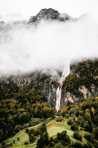 Preview wallpaper mountains, rocks, waterfall, trees, fog, clouds