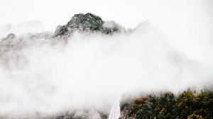 Preview wallpaper mountains, rocks, waterfall, trees, fog, clouds