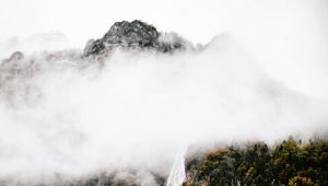 Preview wallpaper mountains, rocks, waterfall, trees, fog, clouds