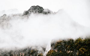 Preview wallpaper mountains, rocks, waterfall, trees, fog, clouds