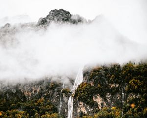 Preview wallpaper mountains, rocks, waterfall, trees, fog, clouds