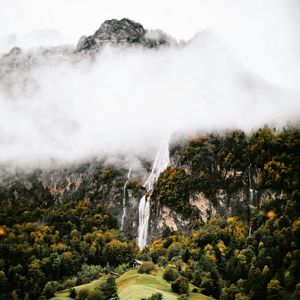 Preview wallpaper mountains, rocks, waterfall, trees, fog, clouds