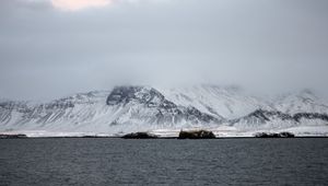 Preview wallpaper mountains, sea, fog, snow, horizon, reykjavik, iceland