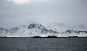 Preview wallpaper mountains, sea, fog, snow, horizon, reykjavik, iceland