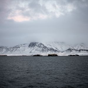 Preview wallpaper mountains, sea, fog, snow, horizon, reykjavik, iceland
