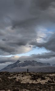 Preview wallpaper mountains, silhouette, clouds, overcast, loneliness, solitude