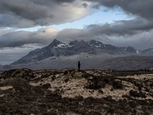 Preview wallpaper mountains, silhouette, clouds, overcast, loneliness, solitude