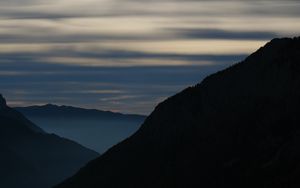 Preview wallpaper mountains, silhouettes, clouds, landscape, nature, twilight, dark