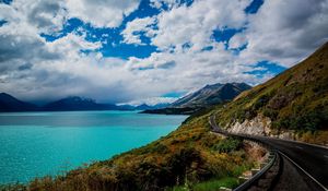 Preview wallpaper mountains, sky, grass, sea, rail