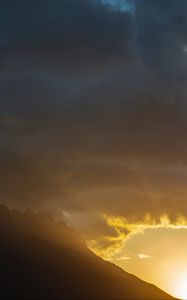 Preview wallpaper mountains, slope, clouds, rays, sun