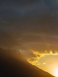 Preview wallpaper mountains, slope, clouds, rays, sun