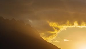 Preview wallpaper mountains, slope, clouds, rays, sun