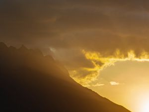 Preview wallpaper mountains, slope, clouds, rays, sun