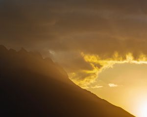 Preview wallpaper mountains, slope, clouds, rays, sun