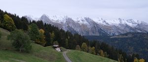 Preview wallpaper mountains, slope, house, trees, landscape, nature