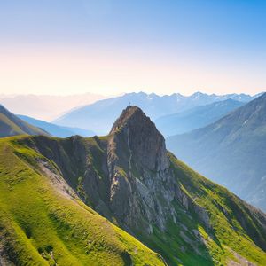 Preview wallpaper mountains, slope, rock, grass, landscape