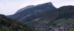 Preview wallpaper mountains, slope, trees, houses, village, valley