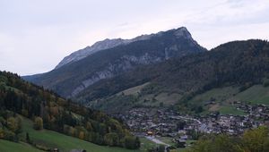 Preview wallpaper mountains, slope, trees, houses, village, valley