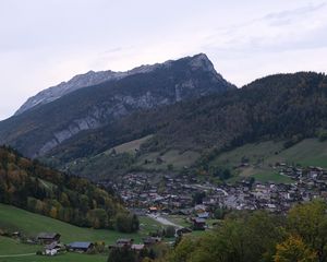 Preview wallpaper mountains, slope, trees, houses, village, valley