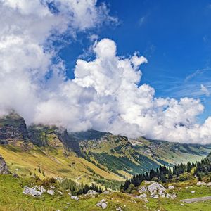 Preview wallpaper mountains, slope, valley, stones, clouds, landscape