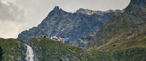 Preview wallpaper mountains, slope, waterfall, house, grass, nature